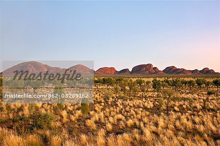 Australia,Northern Territory. The Olgas,otherwise known as Kata Tjuta (meaning 'many heads’),at sunrise. This range is made up of 36 rounded domes with the tallest 546 metres high.