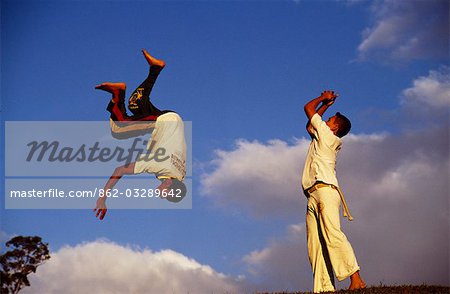 Two boys practice Capoeira,the Brazilian martial art.