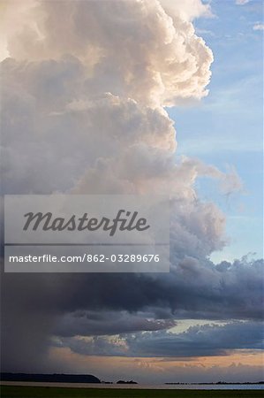 Dramatic evening storm clouds gather over the Tapajos river,a tributary of the Amazon River in the Amazonas Region of Brazil