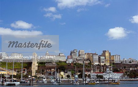 Brazil,Bahia,Salvador. Within the historic Old City,a UNESCO World Heritage site,a view from the sea of both the modern and the historic city with the marina in the foreground.