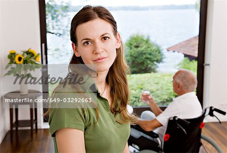 woman caring for man in wheelchair