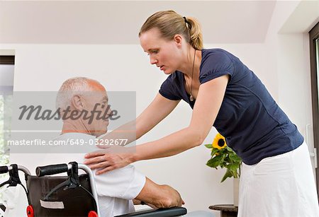 woman helping senior man