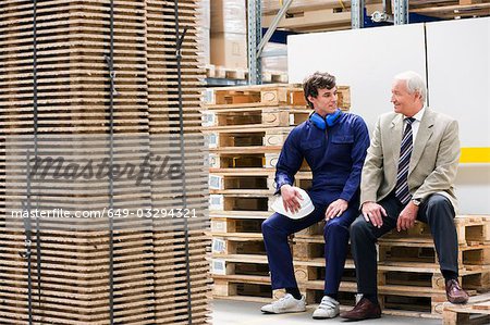 workman and boss in storage