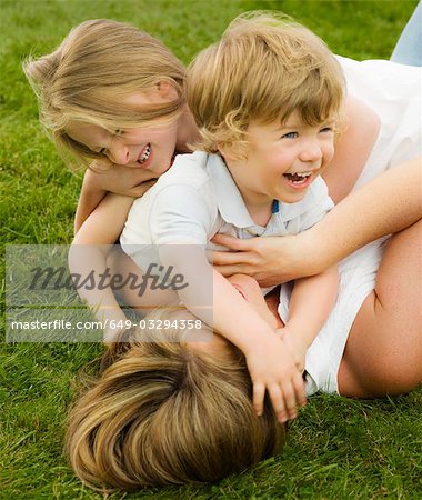 A mother playing with her children