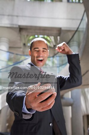 Excited Businessman Reading Text Message