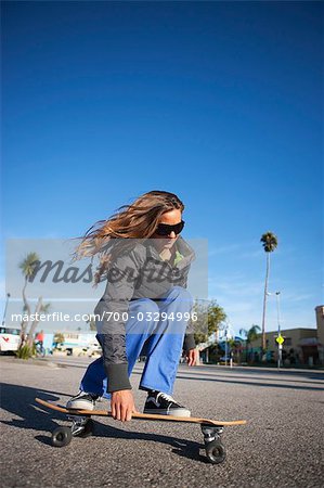 Woman Skateboarding on the Boardwalk, Santa Cruz, California, USA