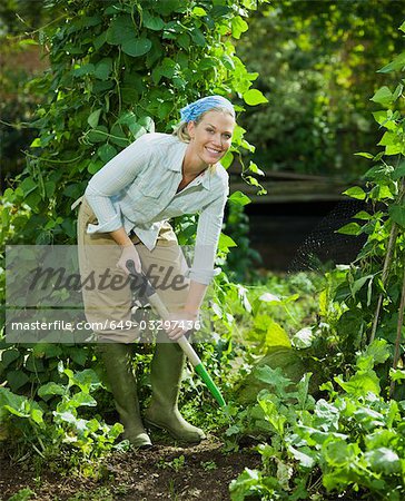 Young female working in a garden