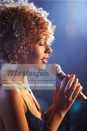 Jazz singer on stage, profile