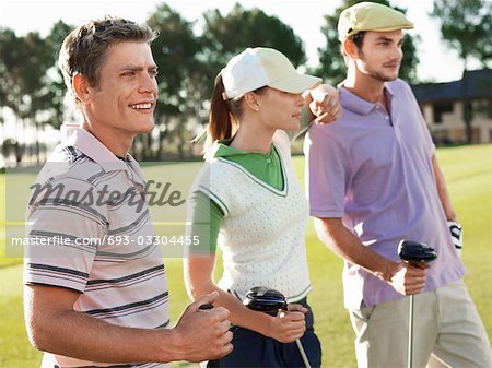 Three young golfers on court