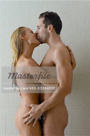 Naked couple embracing in shower