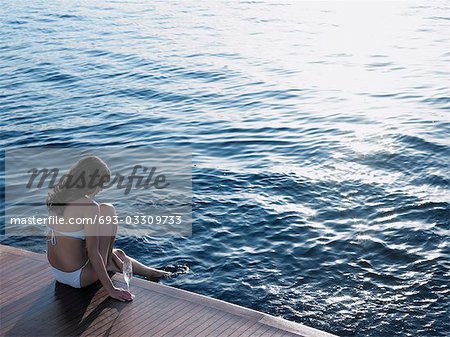 Woman Dipping Foot in Water