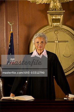 Female judge standing in court, portrait