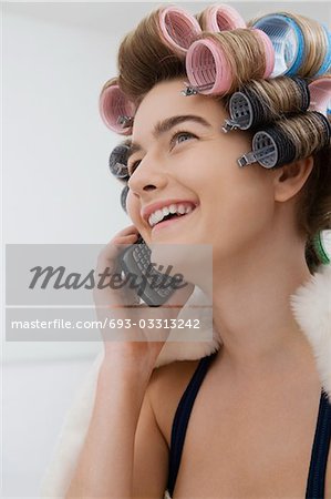 Model in Curlers Talking on Cell Phone