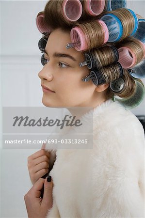 Model in Hair Curlers Wearing Fur Coat