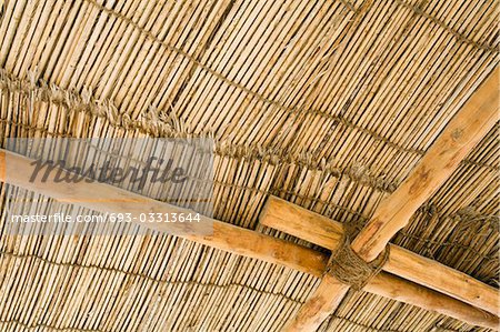 Dubai, UAE, Detail of a wood thatch roof at the Heritage House Museum in Deira.