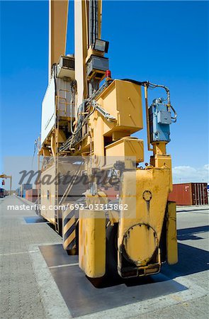 Limassol, Cyprus, Mobile crane moving containers in stockyard