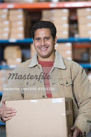Man in distribution warehouse, portrait