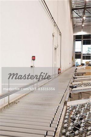 Empty conveyor belt in distribution warehouse