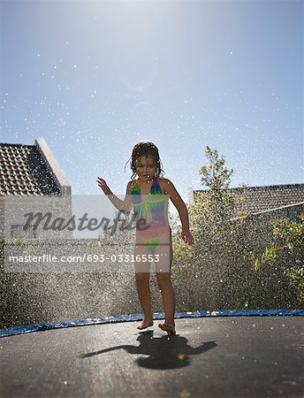 South Africa, Cape Town, girl jumping on trampoline