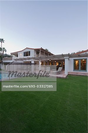 Lawn and swimming pool of Palm Springs home exterior