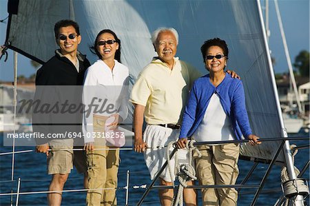 Family on sailboat, (portrait)