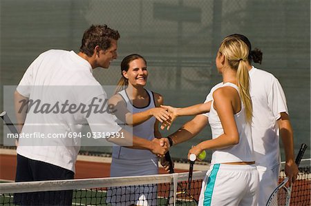 Tennis Players Shaking Hands at Net after tennis match