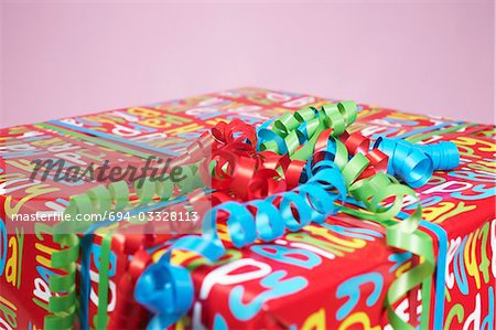 Present wrapped with colourful paper, close-up