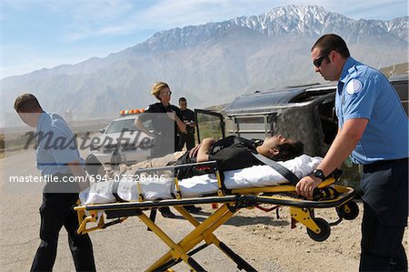 Paramedics transporting victim on stretcher