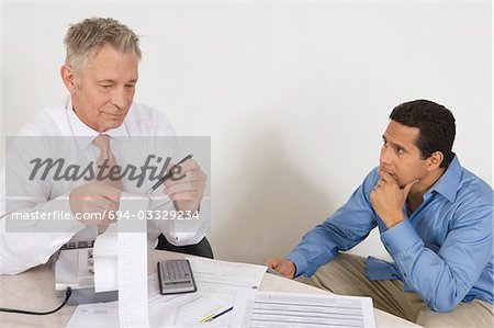 Businessmen Working in Office