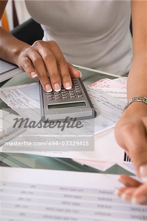 Woman Calculating Bills