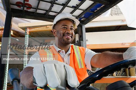 Worker Driving a Forklift