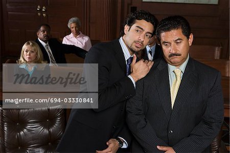 Two men sitting in court