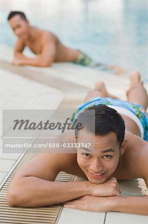 Man Lying Pool Side