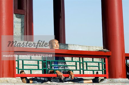 A Chinese man stretching at Wanchun Pavilion (All Time Spring Pavilion),Jingshan Park,Beijing,China