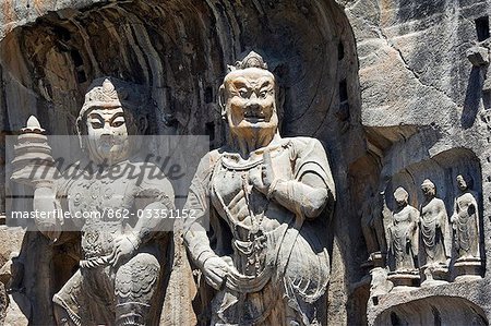 Geschnitzten Buddha-Statuen in Longmen Grotten, Dragon Gate Grotten am Yi er River, Henan Provinz, China