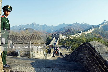 China,Beijing,The Great Wall of China at Badaling near Beijing. A military soldier stands guard on The Great Wall.