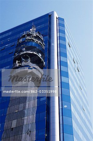 Reflection of the Entel Communications Tower in an office building,La Moneda