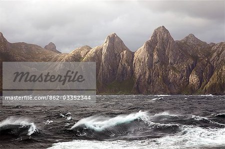 Chile,Tierra del Fuego,Strait of Magellan. Storms and high winds have always made this crucially important seaway and interesting challenge for mariners and high winds sends spindrift across the surface of the channel with dramatic backdrop of Terra Del Fuego mountains