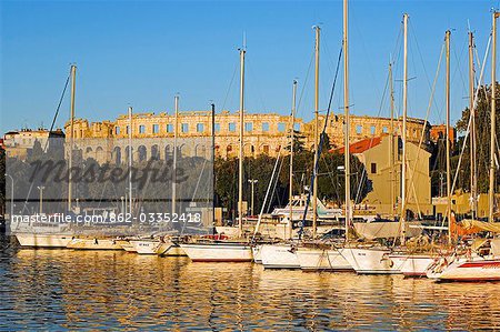 Late Afternoon Light on Yachts in Harbour with the Roman Amphitheatre in the background