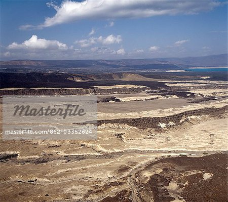 The inhospitable countryside between Garrayto and Lake Assal is strewn with lava and pale,friable material discharged from nearby volcanoes.