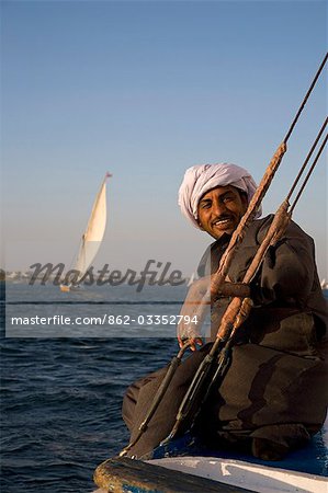 A felucca captain smiles as he sails down the Nile at Luxor.
