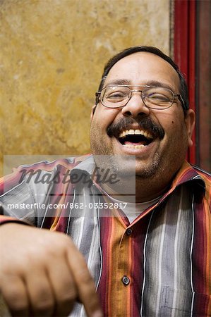 A jeweller in Khan el-Khalili enjoys a joke,Cairo,Egypt