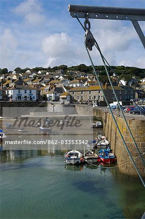 View of the Cornish fishing village of Mousehole from the harbour wall,Cornwall,England