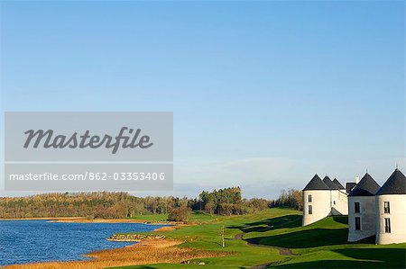 UK,Northern Ireland,Fermanagh,Enniskillen. View of the lake and some of the hotel's 25 lodges at Lough Erne Golf Resort.