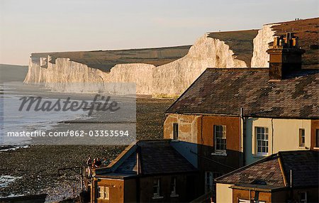 England,East Sussex,Beachy Head. Beachy Head is a chalk headland on the south coast of England,close to the town of Eastbourne. The cliff there is the highest chalk sea cliff in Britain,rising to 162 m (530 ft) above sea level. The peak allows views of the south east coast from Dungeness to the east,to Selsey Bill in the west.