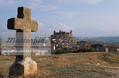 The hilltop village of San Vicente seen from one of the stone crosses that represent the Twelve Stations of the Cross. San Vicente is known for its guild of flagellants who process along the stations of the cross whipping themselves in penance as they go.