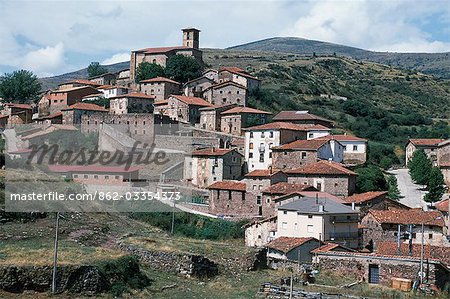 The tiled roofs of the houses and village church of Villoslada de Cameros look down on the Iregua Valley