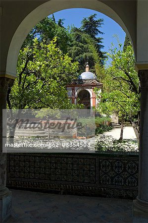 View of an elegant domed building in the gardens of the Real Alcazar Palace,Seville,Spain
