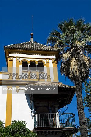 The elegant wrought iron balustrade of a balcony on a mansion in Seville's Barrio Santa Cruz.