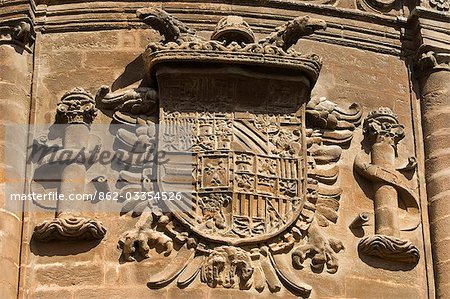 Spain,Andalucia,Seville. A coat of arms on the wall of Seville Cathedral.